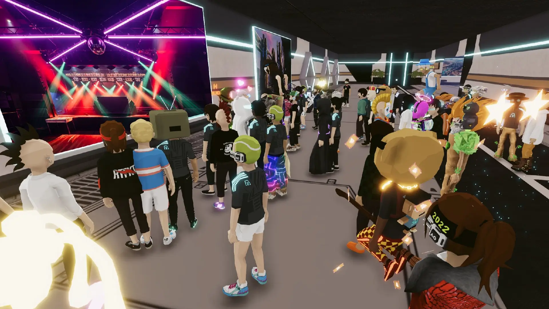 Many digital avatars observing fashion and art displays in the Decentraland metaverse fashion
                        conference.